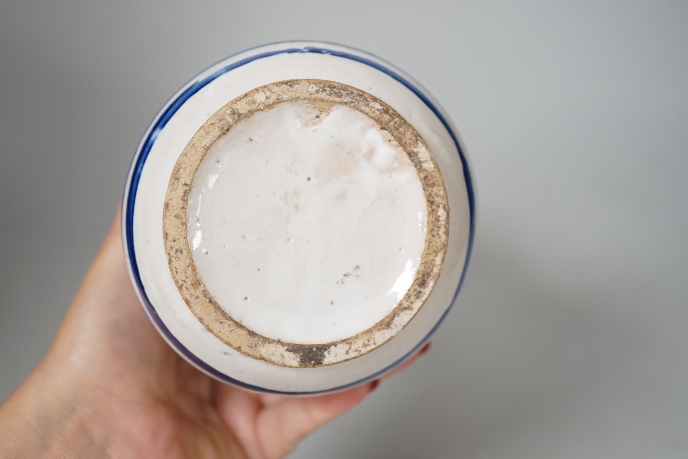 An Italian maiolica albarello, inscribed 1702, 20.5cm high